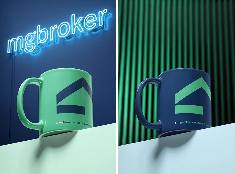 MG Broker branding on mugs sitting on concrete blocks.