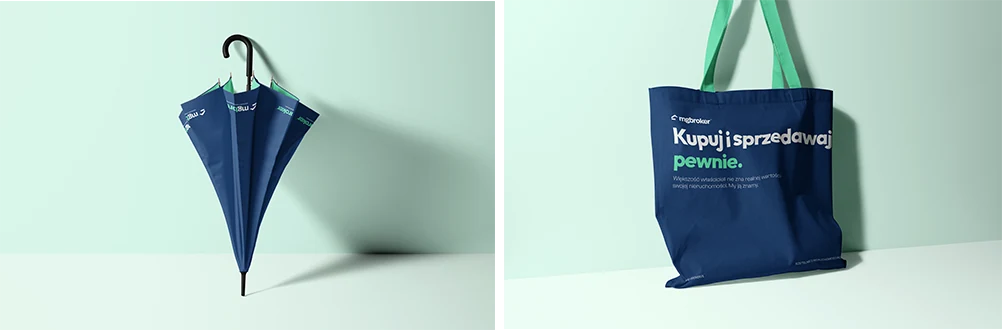 A branded tote bag and an umbrella in the MG Broker identity.
